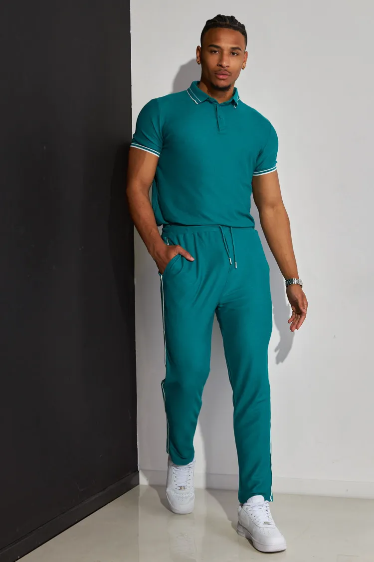 Ensemble 2 pièces polo + pantalon vert à détail blanc